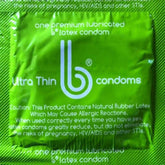 A square, green box of bCondoms Ultra Thin Lubricated Condoms features branding and cautionary text, promising maximum pleasure. This premium lubricated latex condom package highlights the potential for allergic reactions to natural rubber latex.